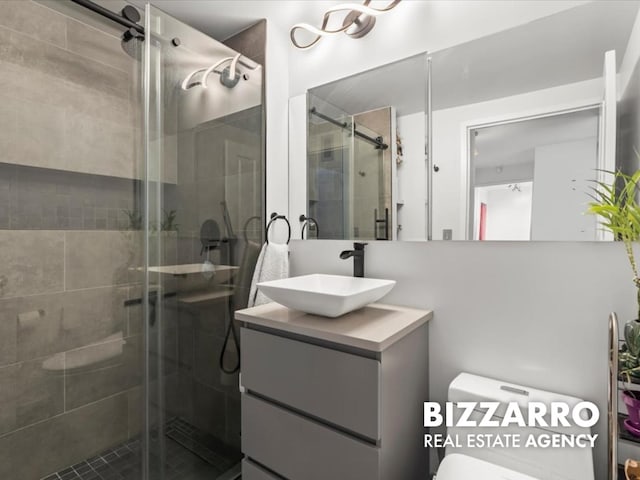 300 W 135th St Unit 8A, New York City, NY 10030 - bathroom featuring vanity, a shower stall, and toilet