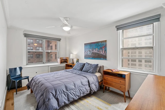 233 E 69th St Unit 11-B, New York City, NY 10021 - bedroom featuring ornamental molding, wood finished floors, and a ceiling fan