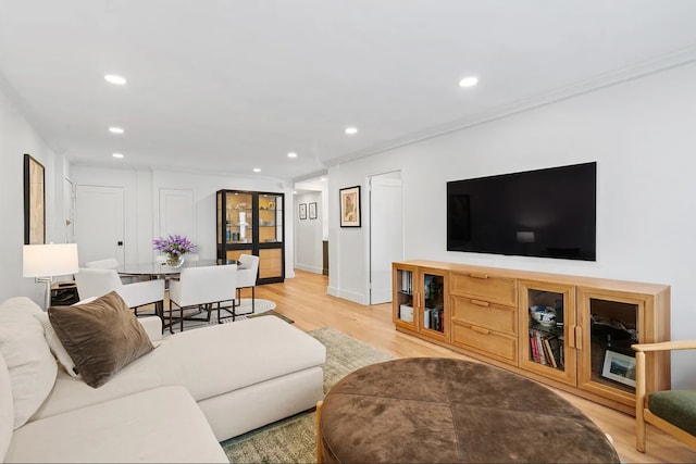 233 E 69th St Unit 11-B, New York City, NY 10021 - living area with light wood-style flooring, recessed lighting, ornamental molding, and baseboards