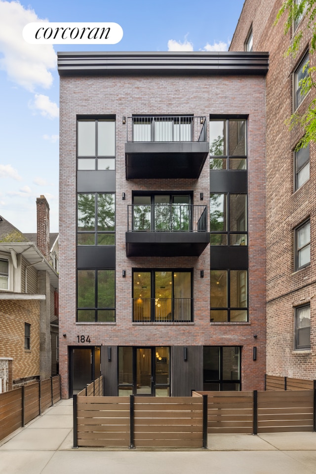 184 Hawthorne St Unit 3A, New York City, NY 11225 - view of apartment building / complex with a fenced front yard