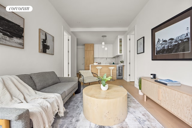 184 Hawthorne St Unit 3A, New York City, NY 11225 - living area featuring beverage cooler and wood finished floors