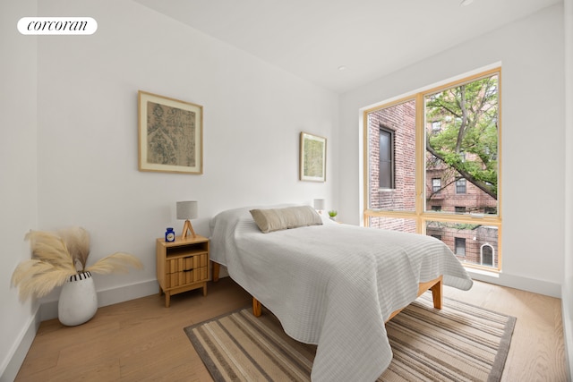 184 Hawthorne St Unit 3A, New York City, NY 11225 - bedroom with baseboards and light wood-style floors