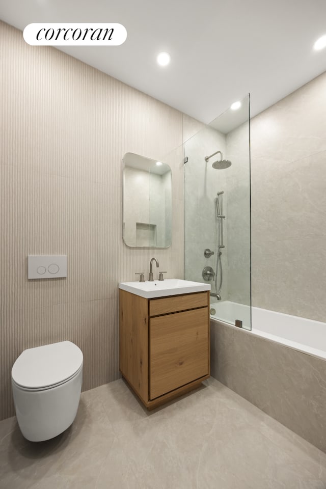 184 Hawthorne St Unit 3A, New York City, NY 11225 - bathroom with a combined bath / shower with marble appearance, vanity, toilet, and recessed lighting