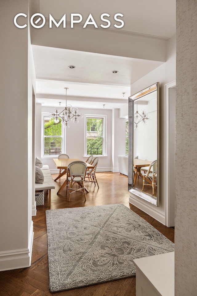 201 W 89th St Unit 2F, New York City, NY 10024 - dining space with a chandelier and baseboards
