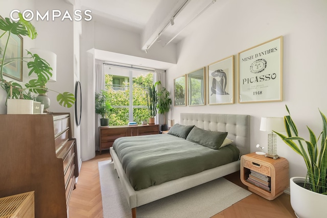 184 Kent Ave Unit B404, New York City, NY 11249 - bedroom with rail lighting and a towering ceiling