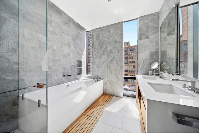 277 5th Ave Unit 25D, New York City, NY 10016 - full bath with a garden tub, double vanity, and tile walls