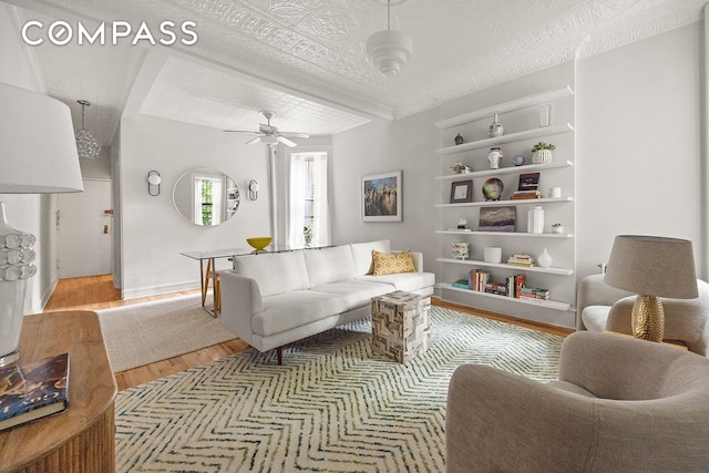 162 Garfield Pl Unit 1L, New York City, NY 11215 - living area featuring wood finished floors, built in shelves, and ceiling fan