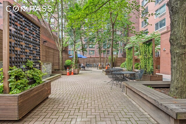 250 S End Ave Unit 3F, New York City, NY 10280 - view of property's community featuring outdoor dining area and a patio area