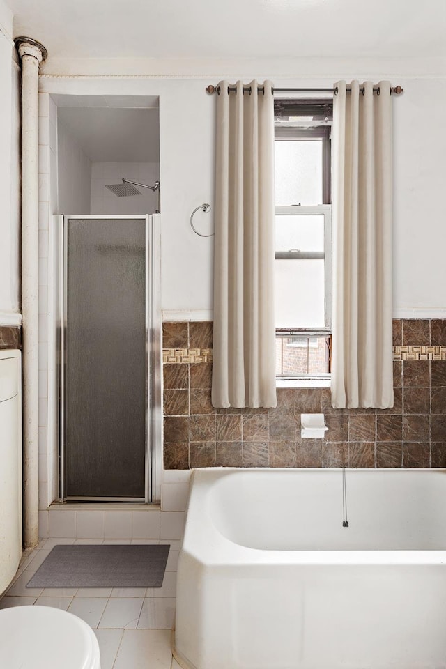 50 Lefferts Ave Unit 4F, New York City, NY 11225 - bathroom featuring a stall shower, a bath, toilet, and tile walls