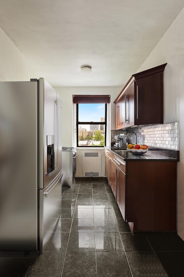 50 Lefferts Ave Unit 4F, New York City, NY 11225 - kitchen with stainless steel fridge with ice dispenser, radiator, granite floors, dark countertops, and gas range gas stove
