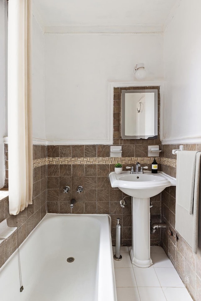 50 Lefferts Ave Unit 4F, New York City, NY 11225 - bathroom featuring a garden tub, a sink, crown molding, and tile patterned flooring