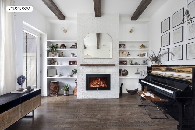 61 Engert Ave Unit 1, New York City, NY 11222 - living area with wood finished floors, beam ceiling, a fireplace, built in shelves, and a barn door