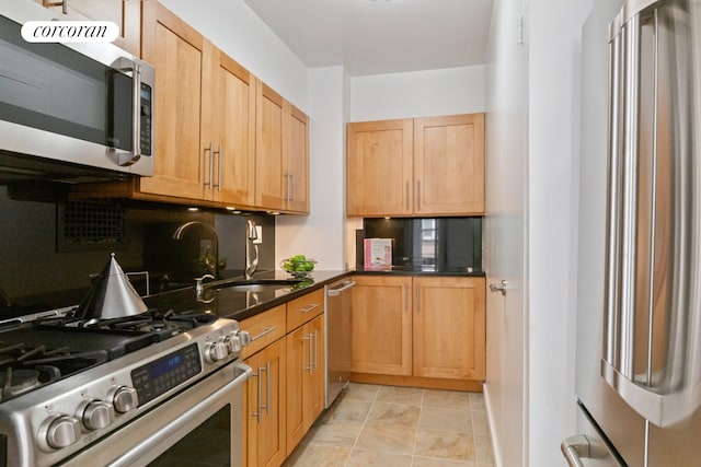 150 E 77th St Unit 3D, New York City, NY 10075 - kitchen with stainless steel appliances, a sink, backsplash, and dark countertops