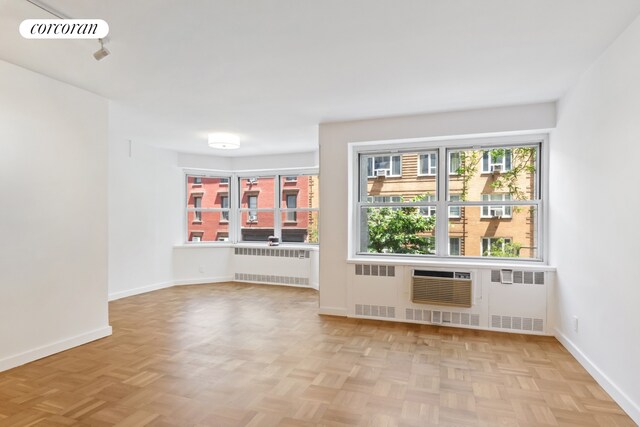 150 E 77th St Unit 3D, New York City, NY 10075 - empty room featuring radiator heating unit and baseboards