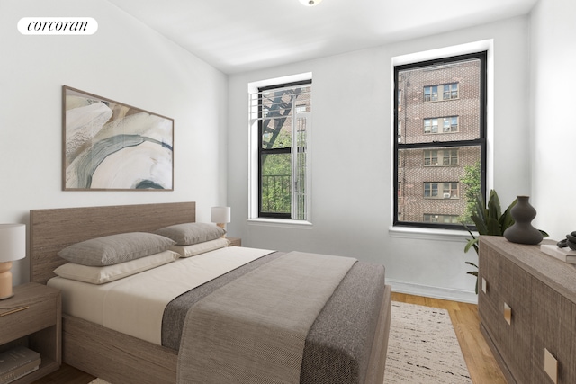 248 E 3rd St Unit 3B, New York City, NY 10009 - bedroom with light wood-style flooring