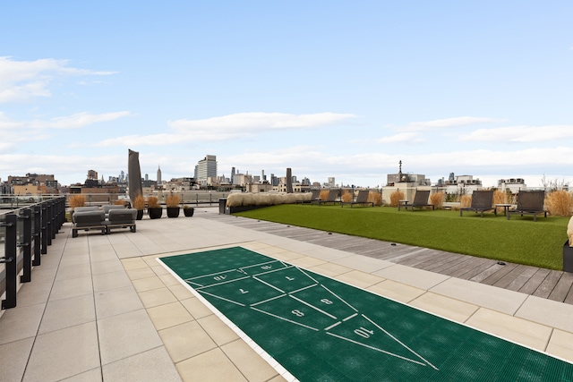 215 N 10th St Unit 4F, New York City, NY 11211 - view of home's community featuring shuffleboard, a view of skyline, and a lawn