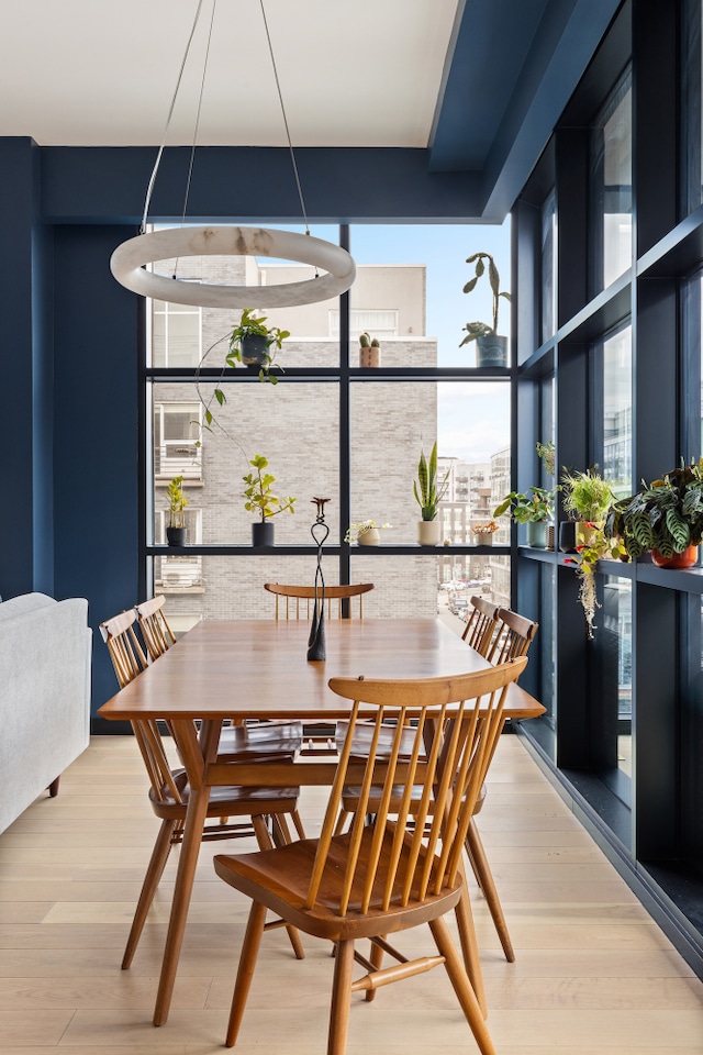 215 N 10th St Unit 4F, New York City, NY 11211 - dining room with floor to ceiling windows and wood finished floors