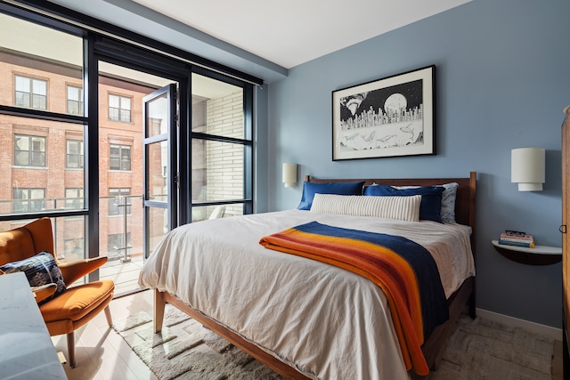 215 N 10th St Unit 4F, New York City, NY 11211 - bedroom featuring floor to ceiling windows