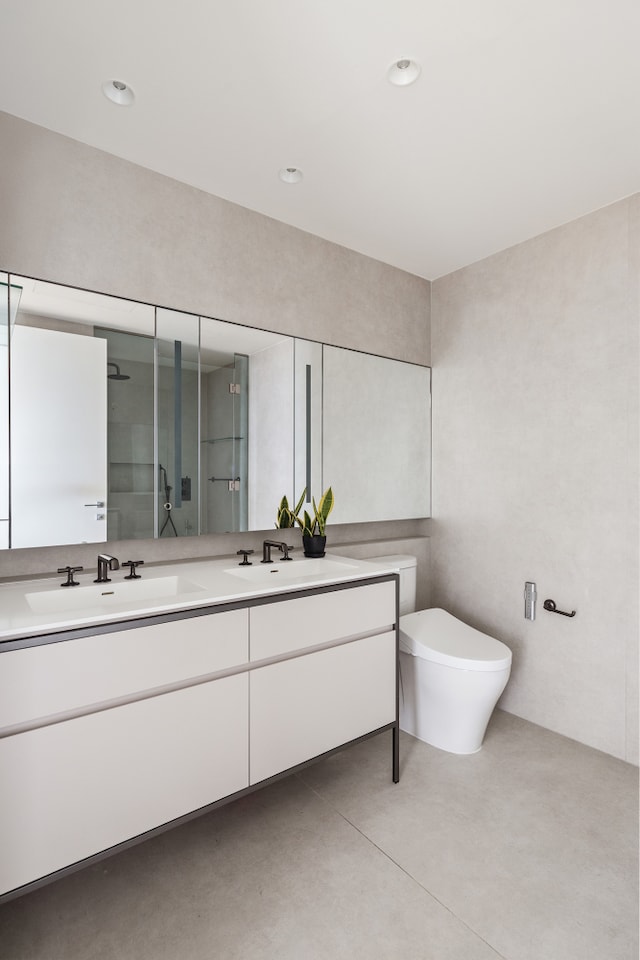 215 N 10th St Unit 4F, New York City, NY 11211 - full bath featuring double vanity, a shower stall, and recessed lighting