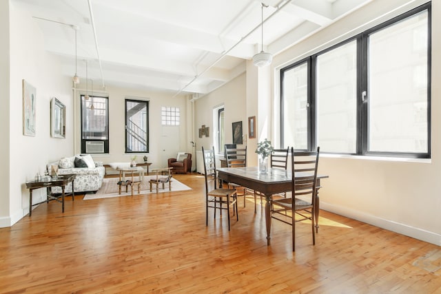 109 W 26th St Unit 8B, New York City, NY 10001 - dining room featuring light wood-type flooring, beamed ceiling, and coffered ceiling