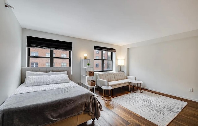 516 W 47th St Unit N-4D, New York City, NY 10036 - bedroom with dark wood-style floors and baseboards