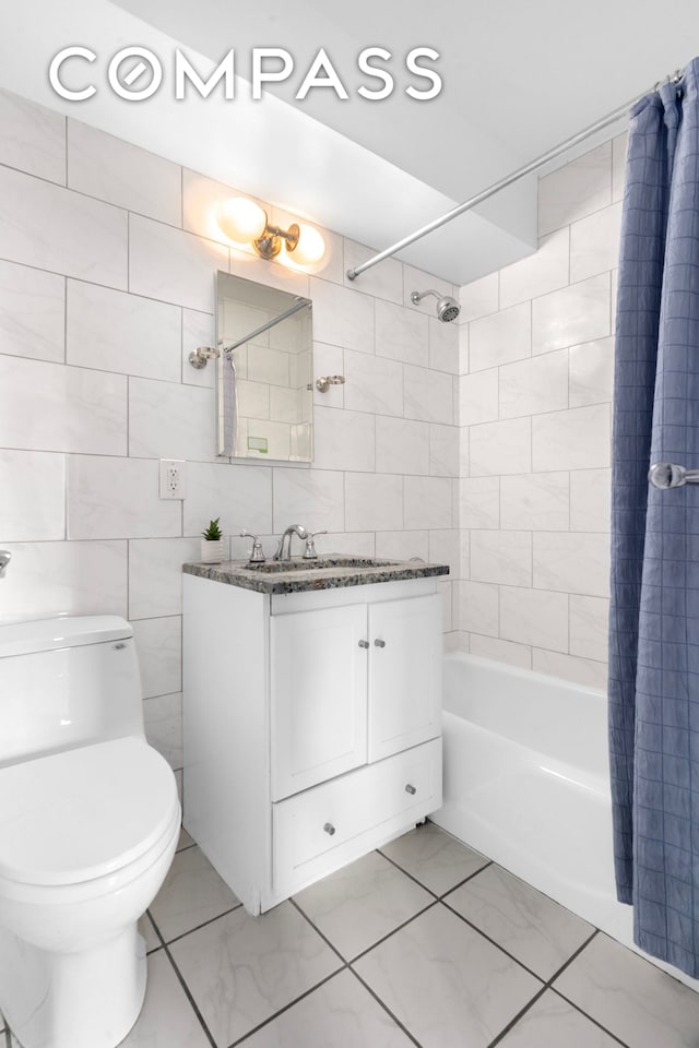 303 W 66th St Unit 18Ee, New York City, NY 10023 - full bathroom with shower / tub combo, vanity, and tile walls