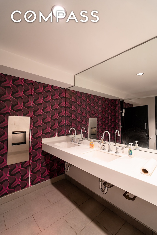428 W 54th Street Retail, New York City, NY 10019 - bathroom featuring tile patterned floors, wallpapered walls, double vanity, and recessed lighting