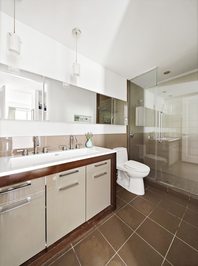 125 N 10th St Unit N2D, New York City, NY 11249 - full bathroom featuring tile patterned flooring, vanity, a stall shower, and toilet