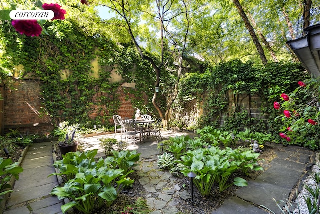 252 W 21st St Garden, Unit Garden, New York City, NY 10011 - fenced backyard featuring a patio area and outdoor dining area