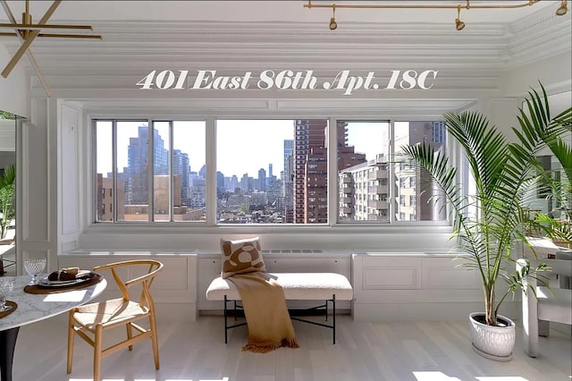 401 E 86th St Unit 18C, New York City, NY 10028 - dining area with a view of skyline, healthy amount of natural light, and wood finished floors