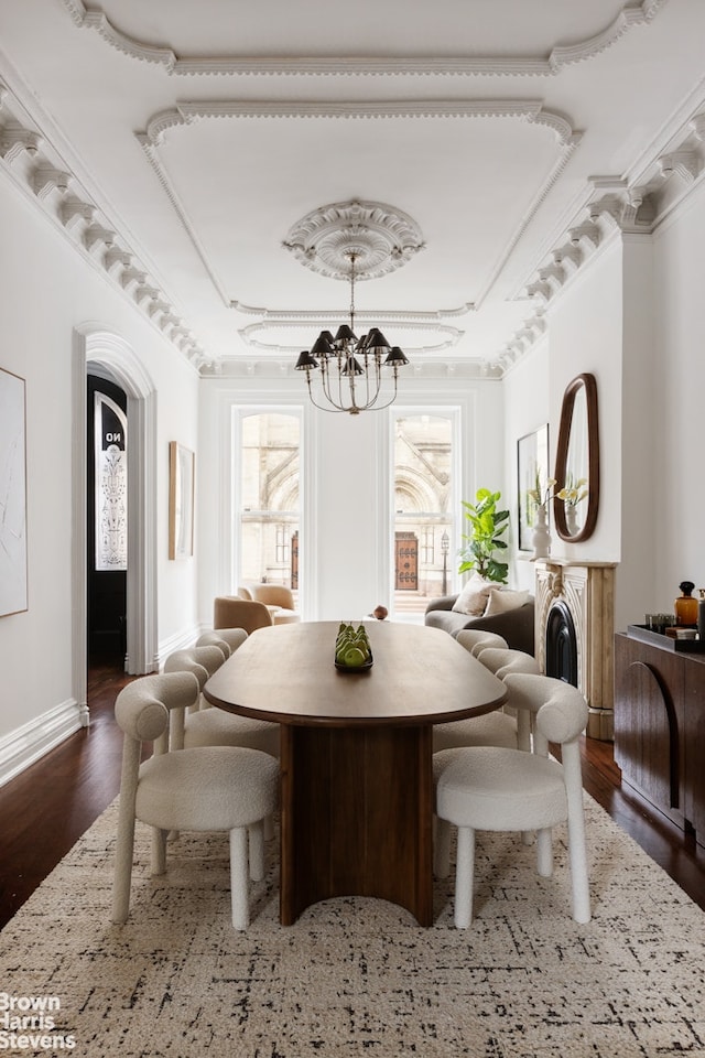 272 Lafayette Ave, New York City, NY 11238 - dining area with a chandelier, wood finished floors, healthy amount of natural light, and arched walkways