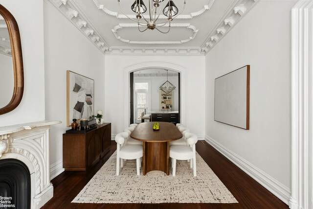 272 Lafayette Ave, New York City, NY 11238 - dining area featuring a chandelier, dark wood finished floors, and arched walkways