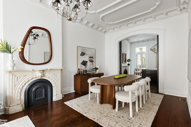 272 Lafayette Ave, New York City, NY 11238 - dining space featuring wood finished floors, a chandelier, and a fireplace