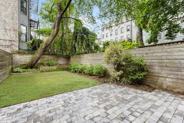 272 Lafayette Ave, New York City, NY 11238 - fenced backyard featuring a patio area