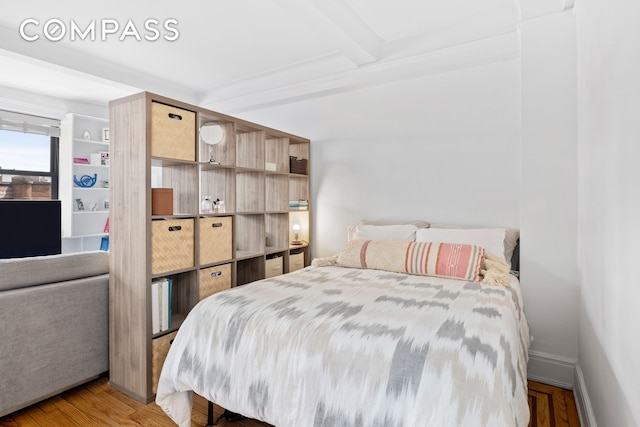 102 W 85th St Unit 9B, New York City, NY 10024 - bedroom featuring wood finished floors and beam ceiling
