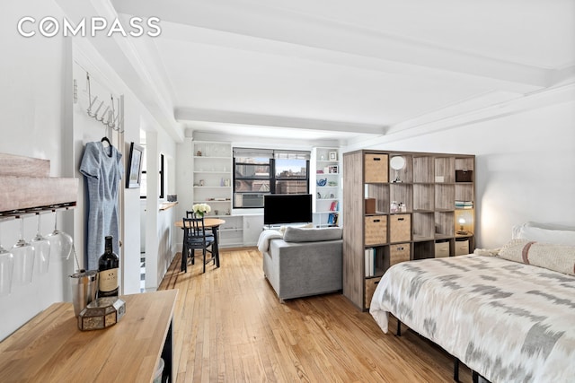 102 W 85th St Unit 9B, New York City, NY 10024 - bedroom featuring light wood-type flooring, beamed ceiling, and cooling unit