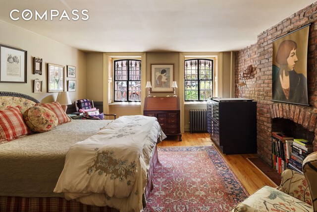 433 Pacific St, New York City, NY 11217 - bedroom featuring radiator heating unit and light wood-style flooring