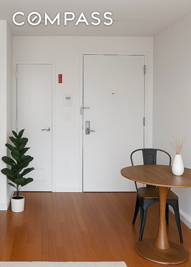 31 Monroe St Unit 9B, New York City, NY 10002 - entryway featuring wood finished floors and baseboards