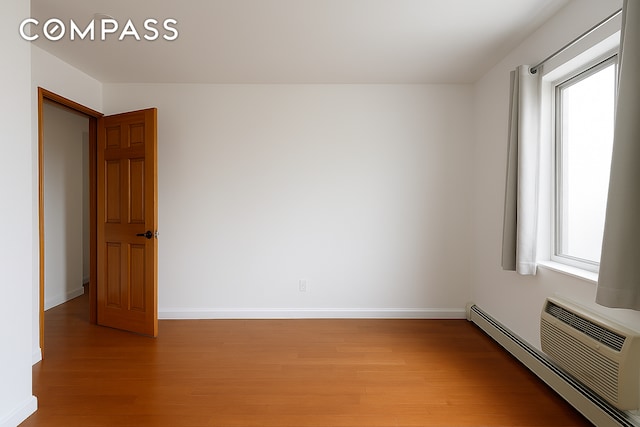 31 Monroe St Unit 9B, New York City, NY 10002 - unfurnished room with light wood-type flooring, baseboard heating, and baseboards