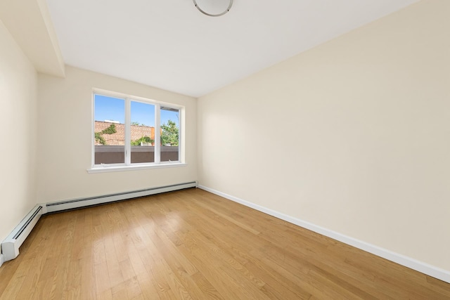 30-63 38th St Unit 2C, New York City, NY 11103 - unfurnished room featuring light wood-style floors and baseboards