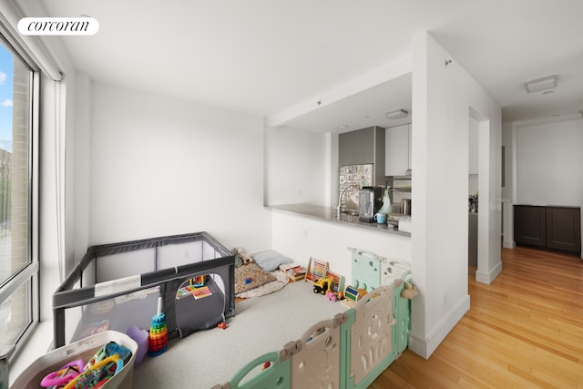 103 Quentin Rd Unit B503, New York City, NY 11223 - bar with light wood-style flooring and baseboards