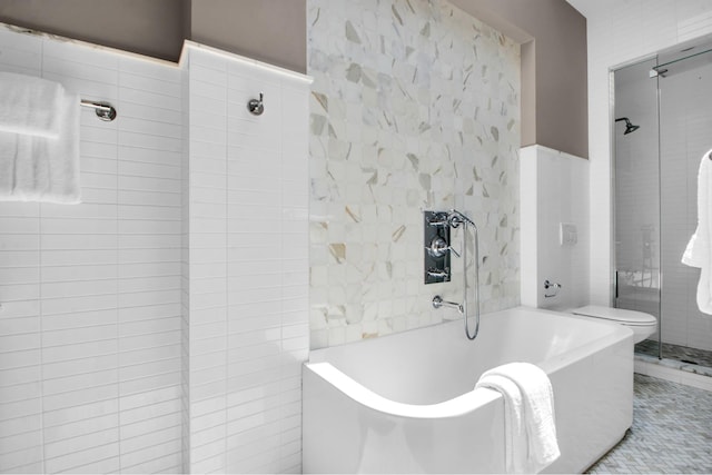 307 E 87th St, New York City, NY 10128 - bathroom with a tub, toilet, and a tile shower