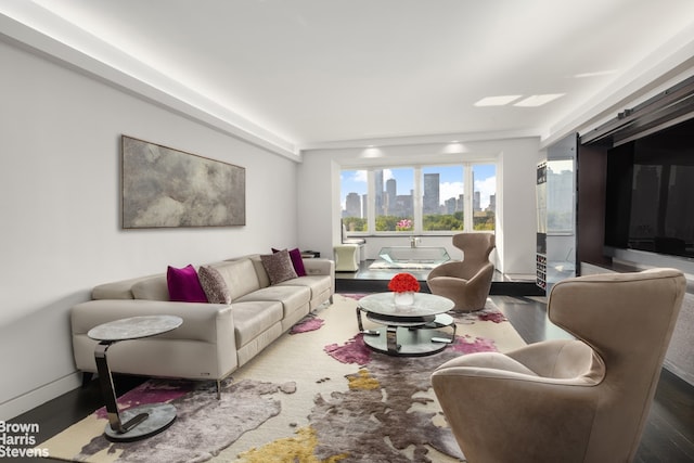 860 5th Ave Unit 11H, New York City, NY 10065 - living area with dark wood-style floors
