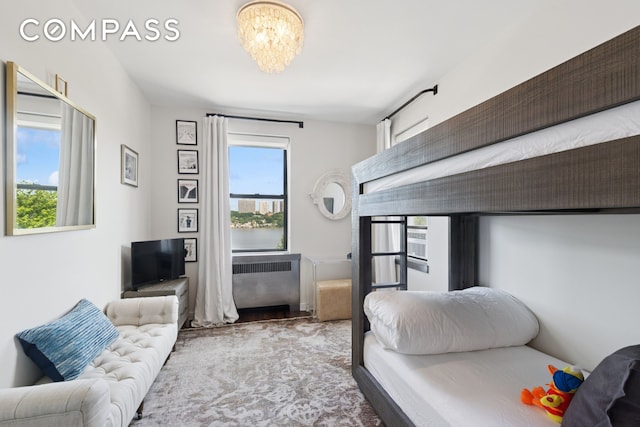 159-34 Riverside Dr W Unit 5A, New York City, NY 10032 - bedroom with radiator and a chandelier