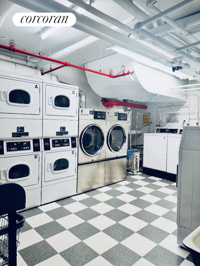 200 E 58th St Unit 12A, New York City, NY 10022 - community laundry room featuring stacked washer and clothes dryer, separate washer and dryer, and light floors