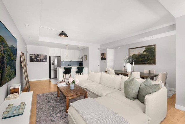 216 E 47th St Unit 12A, New York City, NY 10017 - living area with light wood finished floors and baseboards
