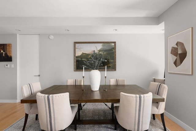 216 E 47th St Unit 12A, New York City, NY 10017 - dining area with light wood finished floors, baseboards, and recessed lighting