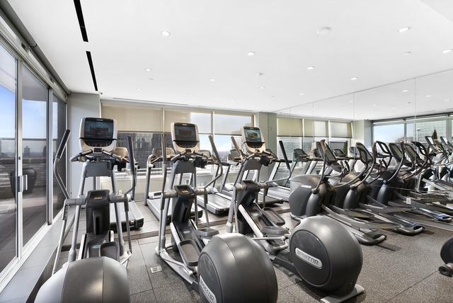 300 E 40th St Unit 6X, New York City, NY 10016 - exercise room with floor to ceiling windows