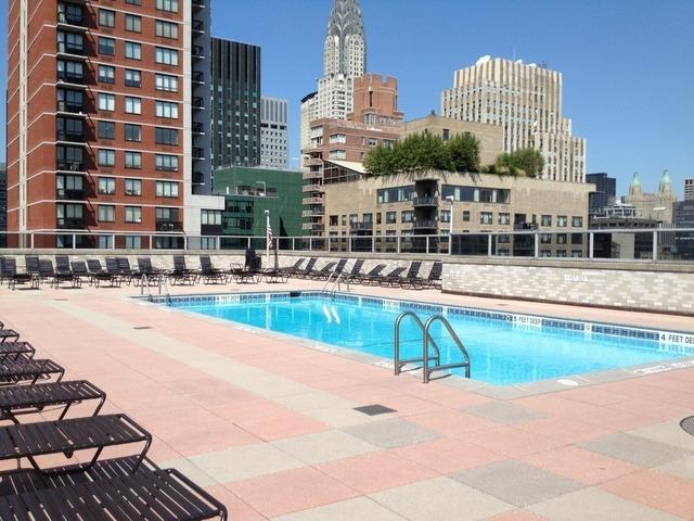 300 E 40th St Unit 6X, New York City, NY 10016 - community pool featuring a skyline view