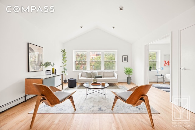 222 23rd St Unit C, New York City, NY 11232 - living area with lofted ceiling, a baseboard radiator, and light wood-type flooring